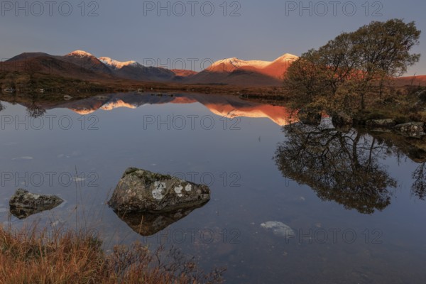 Mountains reflected in lake, morning light, morning mood, still, autumn, snowy, Lochan na