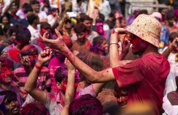 Revellers smear with Gulal or coloured powder and dance to play Holi, the Hindu spring festival of
