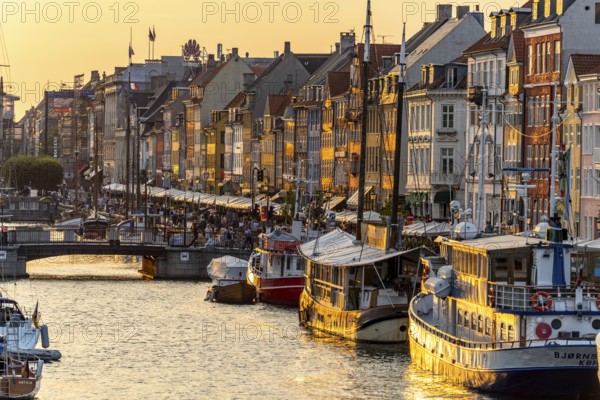 Colourful houses, restaurants and historic ships on the Nyhavn canal and harbour, Copenhagen,