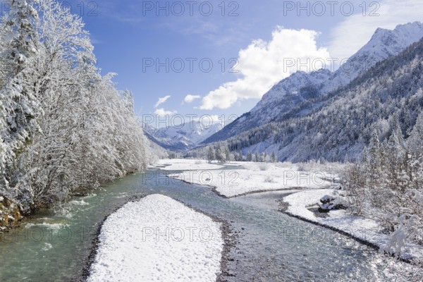 Eng valley in winter. Snow covered landscape with the Riss creek flowing through. Some hoar frosted