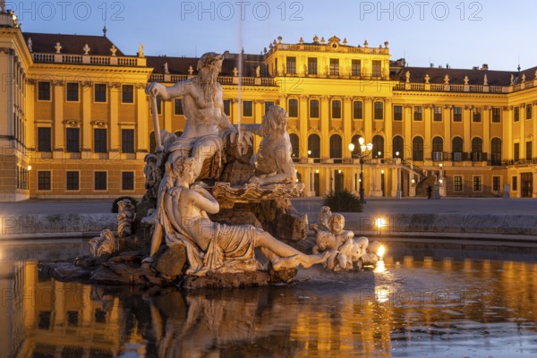 Fountain in the courtyard of honour at Schönbrunn Palace at dusk, UNESCO World Heritage Site in