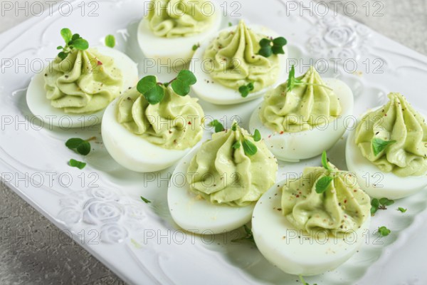 Snack, stuffed eggs with avocado, homemade, no people