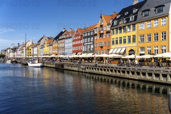 Colourful houses, restaurants and historic ships on the Nyhavn canal and harbour, Copenhagen,