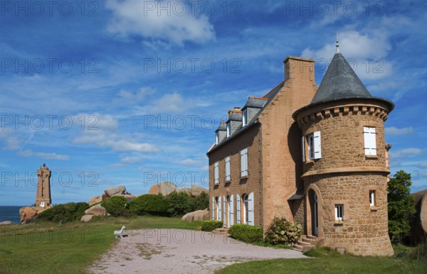 Historic castle with red stone tower under blue sky and clouds, Phare de Men Ruz and Maison Gustave