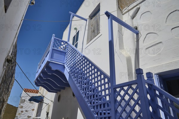 White buildings with blue staircase and clear sky, Chora, Astypalea, Dodecanese, Greek Islands,