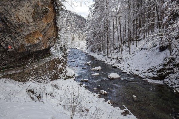 Winter, snowy landscape, river Breitach and hiking trail through the Breitachklamm gorge near