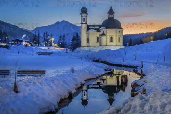 Seekirchl with Hocheder 2797m at dusk in winter, Seefeld, Seefeld Plateau, Tyrol, Austria, Europe