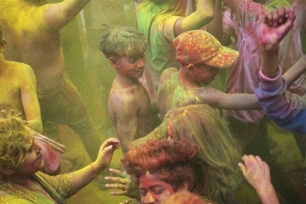 Revellers smear with Gulal or coloured powder and dance to play Holi, the Hindu spring festival of