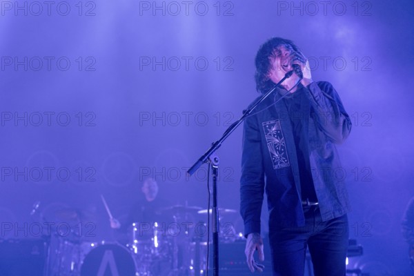Dave Pen, singer and guitarist of Archive live at the Tempodrom in Berlin on 21/02/2025