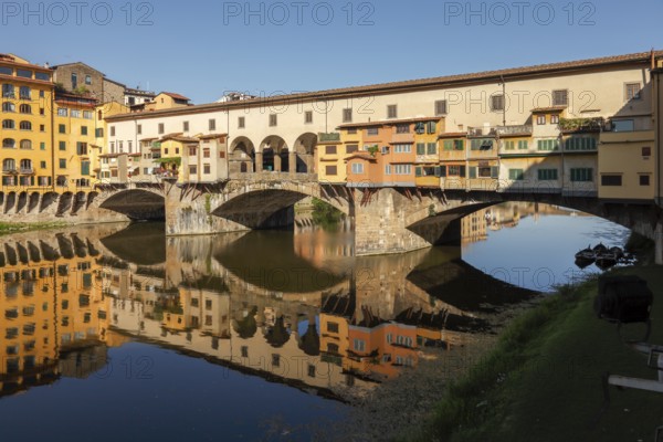 Ponte Vecchio and reflection in the river Arno, Florence, Tuscany, Italy, Europe