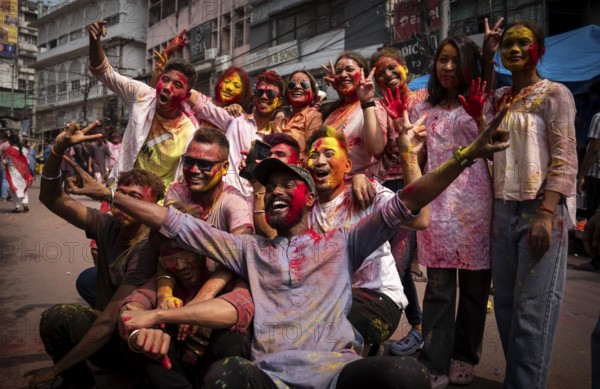 Revellers smear with Gulal or coloured powder and dance to play Holi, the Hindu spring festival of