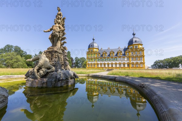Park view of Seehof Castle with reflection in a water basin of the cascade, Hercules Group by
