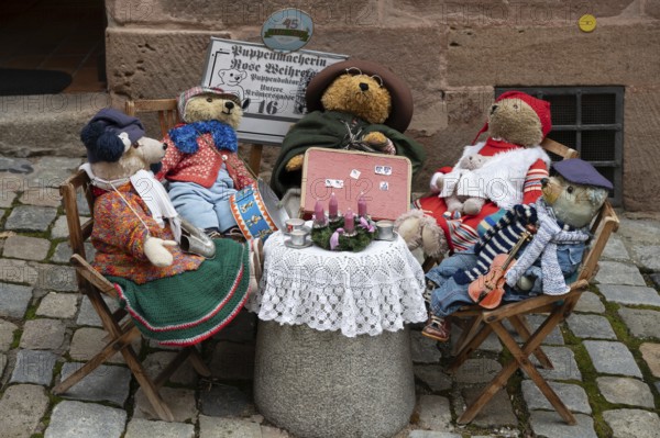 Christmas decoration with teddy bears in front of a doll shop in the historic city centre,