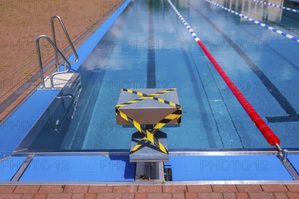 Hagen, North Rhine-Westphalia, Germany - Blocked-off starting block at the edge of the swimming