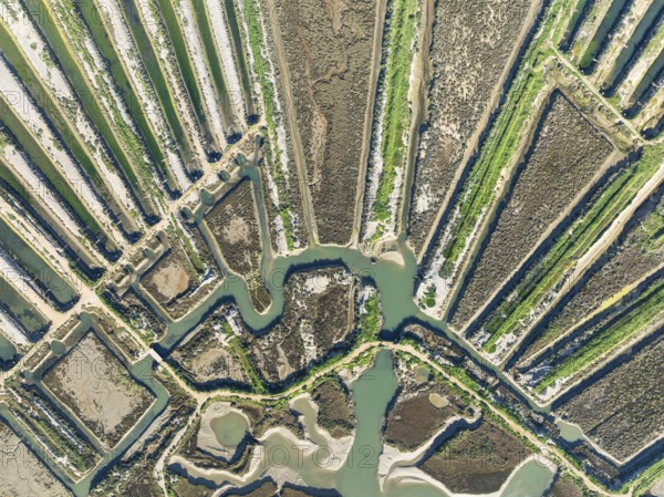 Saline ponds at the salt works of Isla Cristina. Aerial view. Drone shot. Huelva province,
