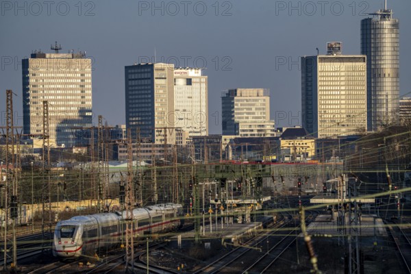 ICE train on the tracks west of Essen central station, skyline of the city centre, North