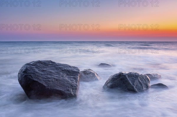 Large boulders in surf at Brodtener Ufer, Brodten Steilufer, cliff in the Bay of Lübeck along the