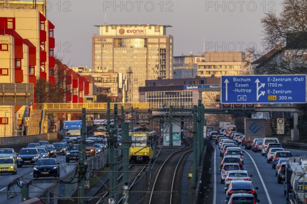 The A40 motorway, Ruhrschnellweg, in the city passage in Essen, light rail line U18, evening