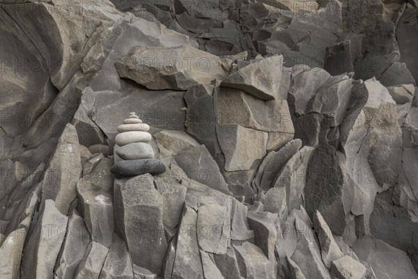 Reynisfjara Beach with Basalt rocks (Stuolabrrg) and the rock needles (Haidrangur), close to Vik i