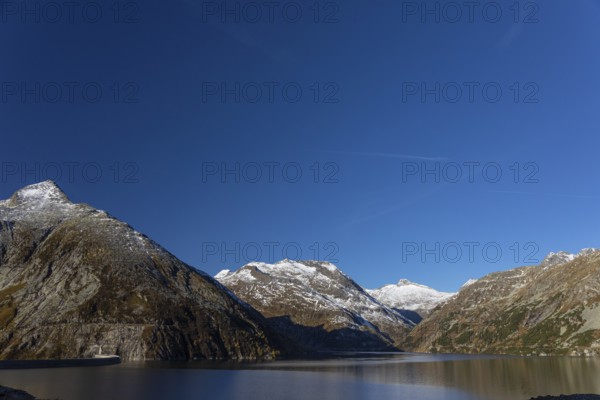 Kölnbrein reservoir and the Oberlecherspitzen mountain on a bright sunny morning. Seen from the