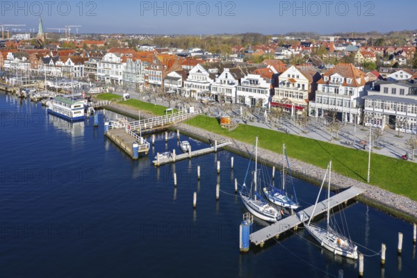 View over shops and restaurants along picturesque Vorderreihe at seaside resort Travemünde,