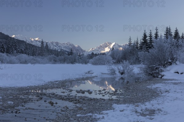 Isar valley in winter at temperatures of minus 18 degrees Celsius. Snow covered landscape with the