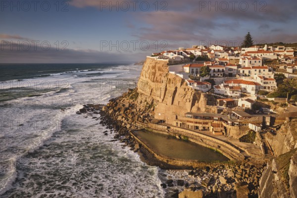 Scenic view of the seaside Azenhas do Mar fishing village on cliff on Atlantic ocean coast,