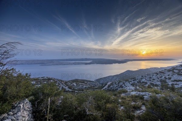 View of a hilly coastline and the island of Pag at sunset, pass road, Pag, Zadar, Croatia, Europe