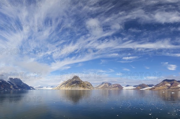 Luciapynten, mountain with steep sea cliffs in Hornsund fjord in summer, Svalbard, Spitsbergen,