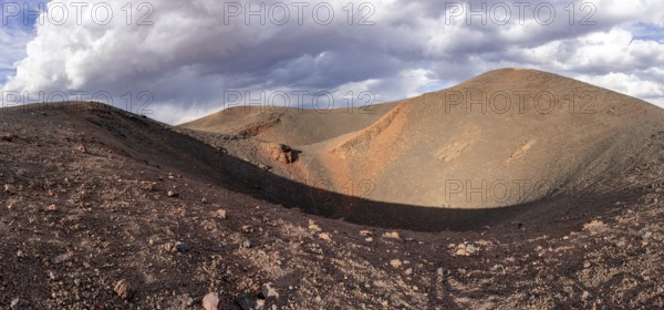 A dried-up volcano with a crater-shaped depression and colourful hills, Argentina, Volcanoes, Lava