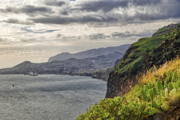 Ponta do Garajau viewpoint at the statue of Christ, Cristo Rei statue, cliffs, weather mood,