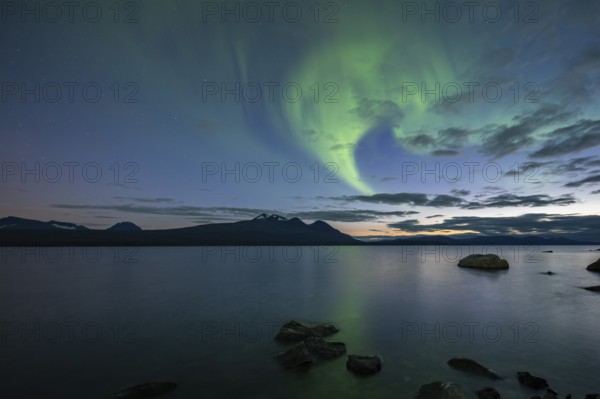 Northern Lights over Lake Akkajaure and Akka mountain range, Stora Sjöfallet National Park,