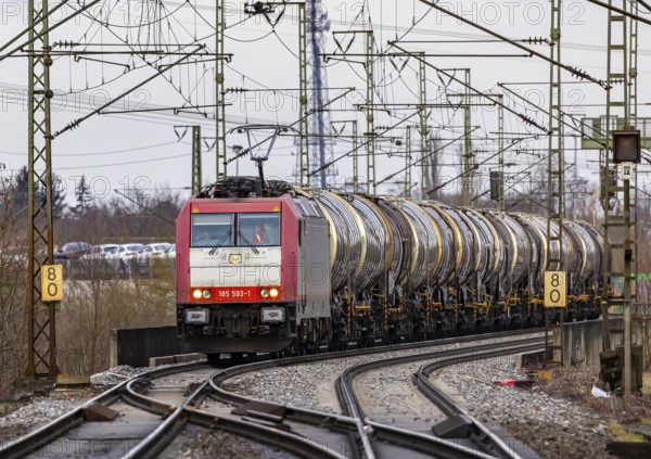 Goods train travelling on the winding Schuster Railway, overhead lines and infrastructure. Tank