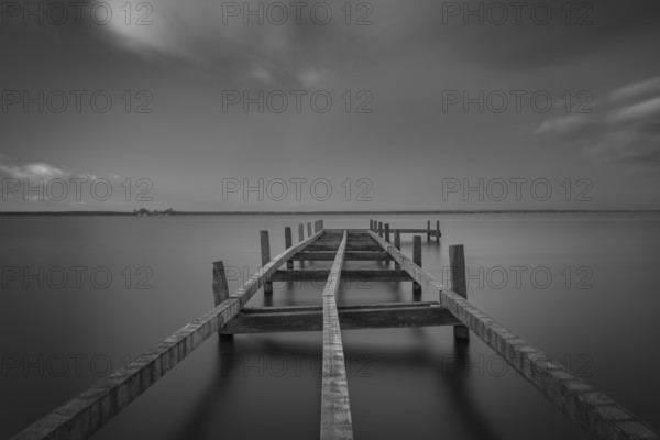 View of a partially dismantled jetty at Steinhuder Meer, Wilhelmstein, long exposure, black and