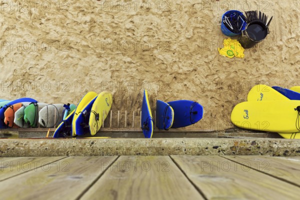 Surfboards leaning against a wall on the beach, surf school, view from above, St. Ives, England,
