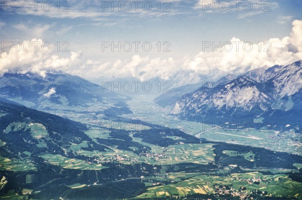 Elevated oblique view of the glaciated Inn Valley, Innsbruck, Austria, Europe 1950s View to the