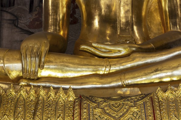 Golden Buddha statue, Phra Buddha Trilokachet, surrounded by exquisite murals, interior view of the
