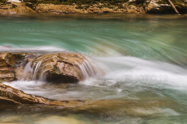 The Riss creek flowing through an autumnal landscape in the Eng valley