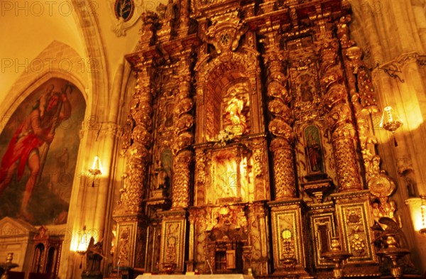 Elaborately decorated gold altar in the cathedral church of Santa Maria La Mayor, Ronda, Andalusia,