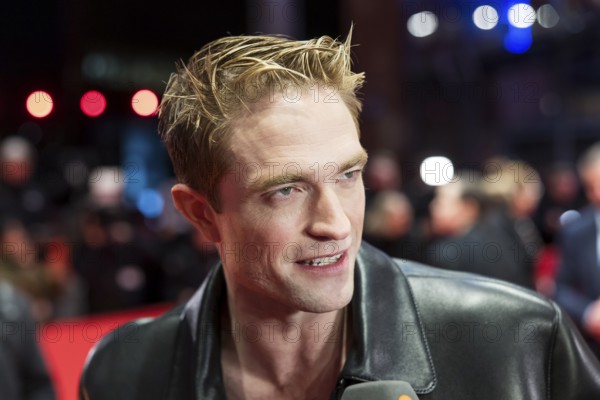 Robert Pattinson gives an interview on the red carpet at the Special Gala of the film Mickey 17 at