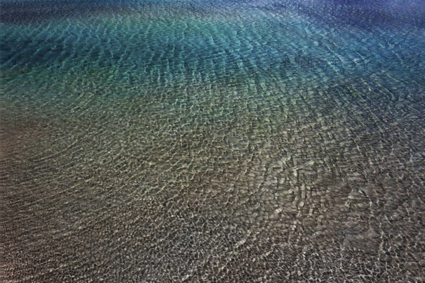 Drone shot, glittering water surface on the beach of Elafonisi, west coast, Crete, Greece, Europe