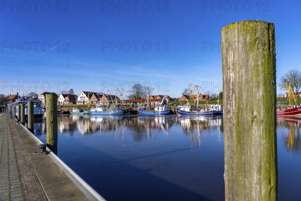 The fishing village of Greetsiel, historic fishing harbour, with the largest shrimp cutter fleet in