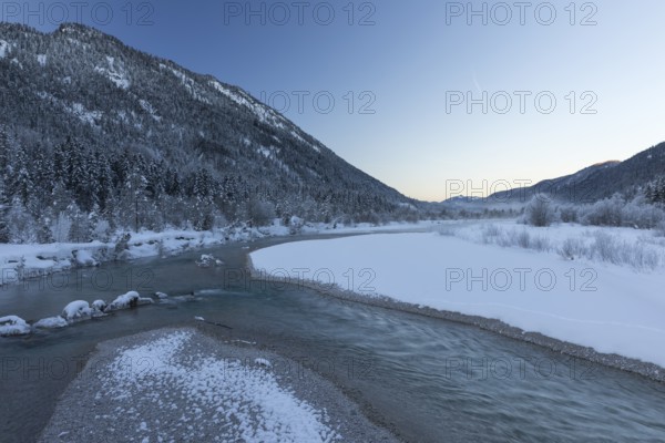 Isar valley in winter at temperatures of minus 18 degrees Celsius. Snow covered landscape with the
