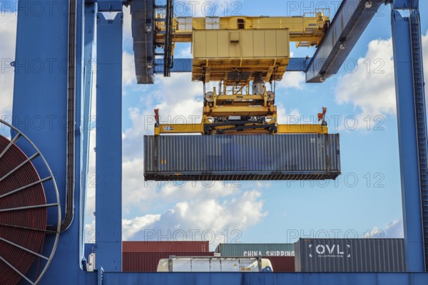 Duisburg, North Rhine-Westphalia, Germany, containers are loaded onto a goods train in the port of