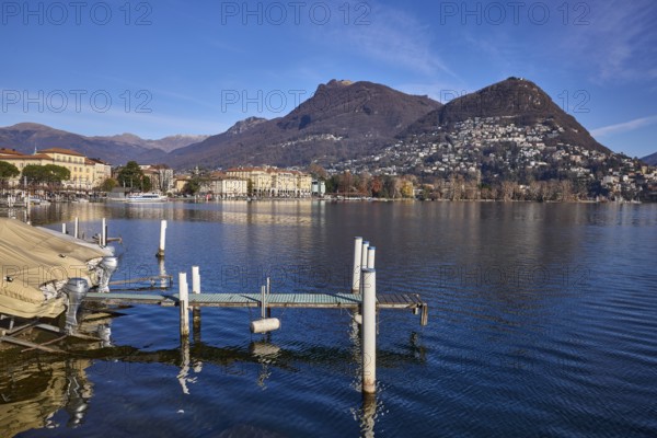 Jetty, motorboat, lake, hill, village, general development, shore, blue sky, cirrostratus clouds,