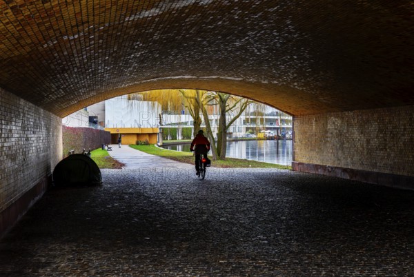 Cyclist in a subway, Berlin, Germany, Europe