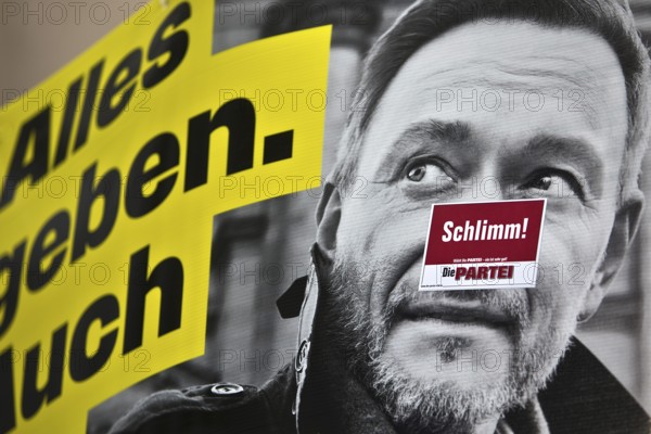 Sticker Schlimm by Die Partei on an FDP election poster with portrait of Christian Lindner, Bochum,