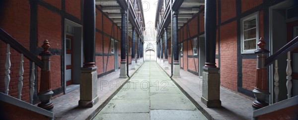 Inner courtyard with wooden portico in the Heiliggeistkloster monastery, Stralsund,