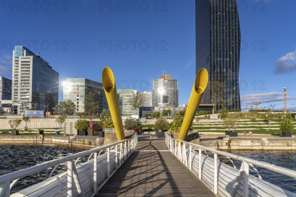 Pontoon bridge Ponte Cagrana and the skyline of Donau City in Vienna, Austria, Europe