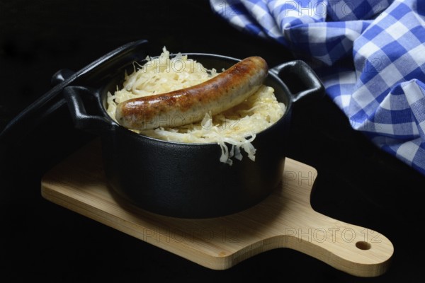 Nuremberg sausages with sauerkraut in a pot, Rostbratwürstchen, Germany, Europe